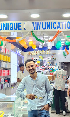 Rinku Birsanta inside Unique Communication store